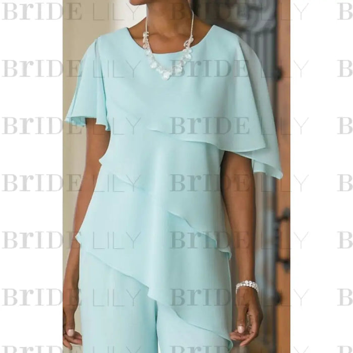 Close-up of tiered chiffon overlay and jewel neckline in mint green