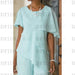 Close-up of tiered chiffon overlay and jewel neckline in mint green