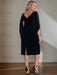 Back view of the teal velvet dress with a draped cowl back