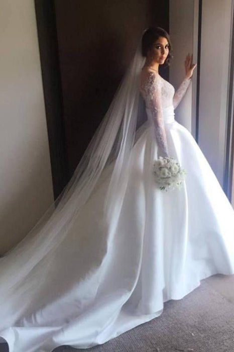 long sleeve lace wedding dress with satin skirt This elegant wedding dress features a beaded lace bodice, high-slit satin skirt, and a tulle overskirt with a long train, blending timeless elegance with modern style , Style 6460 #DanielaDiMarino,