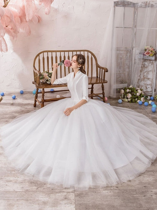 19 Simple, Elegant Wedding Dresses For The Non-Traditional Bride
